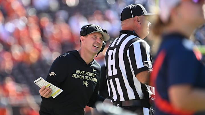 Oct 4, 2025; Blacksburg, Virginia, USA;  Wake Forest Demon Deacons head coach Jake Dickert questions the head referee during the third quarter of the game against the Virginia Tech Hokies at Lane Stadium. Mandatory Credit: Brian Bishop-Imagn Images