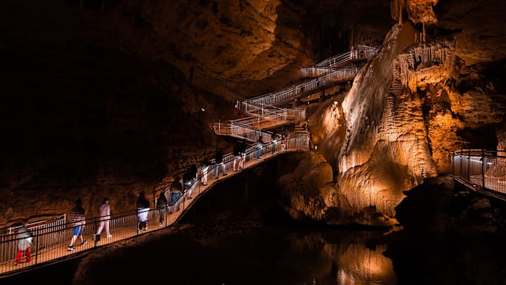 A walkway winds through Missouri’s Onondaga Cave.