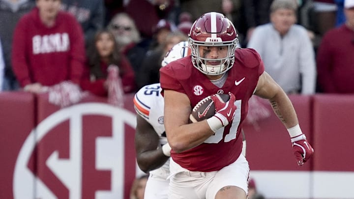 Nov 30, 2024; Tuscaloosa, Alabama, USA; Alabama Crimson Tide tight end CJ Dippre (81) runs after a catch against Auburn Tigers buck Jalen McLeod (35) during the first half at Bryant-Denny Stadium. Mandatory Credit: Gary Cosby Jr.-Imagn Images Nov 30, 2024; Tuscaloosa, Alabama, USA; Alabama Crimson Tide tight end CJ Dippre (81) runs after a catch against Auburn Tigers buck Jalen McLeod (35) during the first half at Bryant-Denny Stadium. Mandatory Credit: Gary Cosby Jr.-Imagn Images