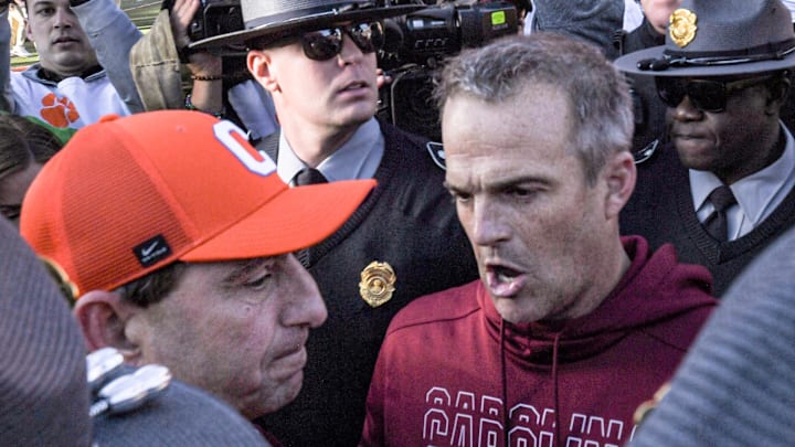 Nov 30, 2024; Clemson, South Carolina, USA; Clemson head coach Dabo Swinney and South Carolina Head Coach Shane Beamer talk after the game at Memorial Stadium. Mandatory Credit: Ken Ruinard-Imagn Images