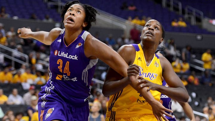 Sep 19, 2013; Los Angeles, CA, USA;  Phoenix Mercury center Krystal Thomas (34) and Los Angeles Sparks center Jantel Lavender (42) battle for the ball in the first half of game 1 of the Western Conference semi-finals at Staples Center. Mandatory Credit: Jayne Kamin-Oncea-Imagn Images