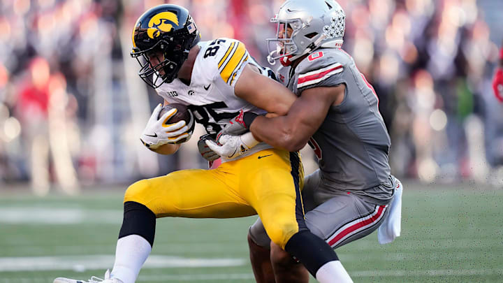 Oct 5, 2024; Columbus, OH, USA; Ohio State Buckeyes linebacker Cody Simon (0) tackles Iowa Hawkeyes tight end Luke Lachey (85) after a catch in the third quarter during the NCAA football game at Ohio Stadium. Oct 5, 2024; Columbus, OH, USA; Ohio State Buckeyes linebacker Cody Simon (0) tackles Iowa Hawkeyes tight end Luke Lachey (85) after a catch in the third quarter during the NCAA football game at Ohio Stadium.