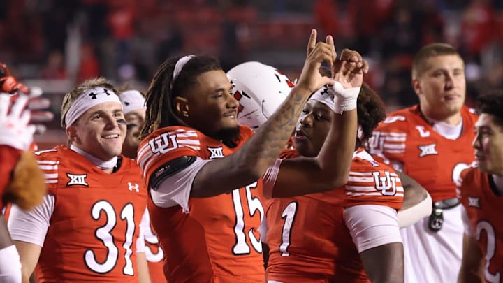 Utah Utes quarterback Byrd Ficklin (15) celebrates a win against the Colorado Buffaloes after the game at Rice-Eccles Stadium.