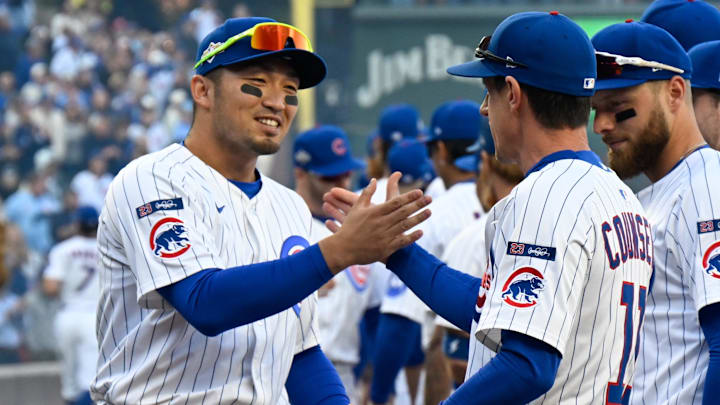 Oct 8, 2025; Chicago, Illinois, USA; Chicago Cubs right fielder Seiya Suzuki (27) shakes hands with manager Craig Counsell (11) prior to game three of the NLDS round against the Milwaukee Brewers for the 2025 MLB playoffs at Wrigley Field. Mandatory Credit: Matt Marton-Imagn Images
