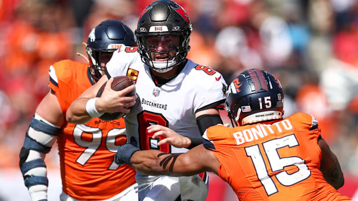Sep 22, 2024; Tampa, Florida, USA; Tampa Bay Buccaneers quarterback Baker Mayfield (6) tries to avoid a tackle by Denver Broncos linebacker Nik Bonitto (15) in the fourth quarter at Raymond James Stadium. Sep 22, 2024; Tampa, Florida, USA; Tampa Bay Buccaneers quarterback Baker Mayfield (6) tries to avoid a tackle by Denver Broncos linebacker Nik Bonitto (15) in the fourth quarter at Raymond James Stadium.