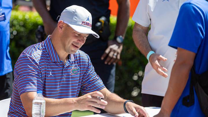 Florida head coach Jon Sumrall autographs items during the second half of the Orange and Blue game at Steve Spurrier Field at Ben Hill Griffin Stadium in Gainesville, FL on Saturday, April 11, 2026. [Alan Youngblood/Gainesville Sun]