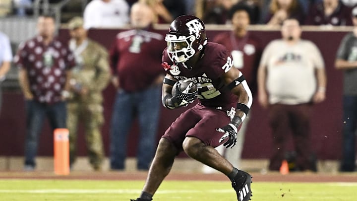 Nov 16, 2024; College Station, Texas, USA; Texas A&M Aggies running back EJ Smith (22) catches a pass against the New Mexico State Aggies during the first half at Kyle Field. Mandatory Credit: Maria Lysaker-Imagn Images 