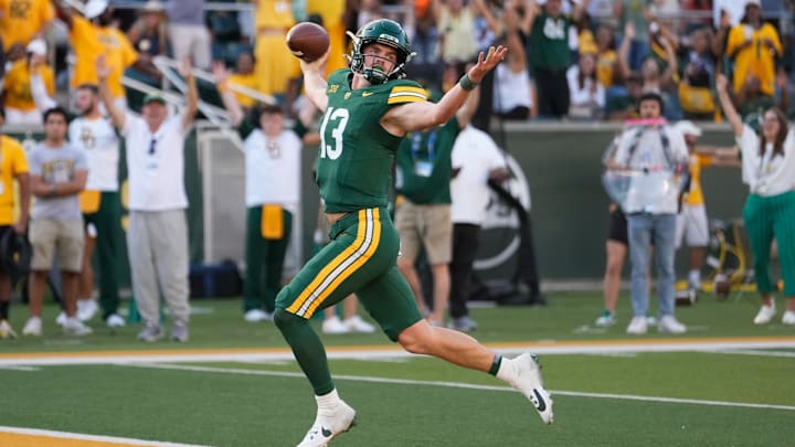Oct 26, 2024; Waco, Texas, USA; Baylor Bears quarterback Sawyer Robertson (13) celebrates after scoring a 41 yard touchdown against the Oklahoma State Cowboys during the second half at McLane Stadium. Mandatory Credit: Chris Jones-Imagn Images Oct 26, 2024; Waco, Texas, USA; Baylor Bears quarterback Sawyer Robertson (13) celebrates after scoring a 41 yard touchdown against the Oklahoma State Cowboys during the second half at McLane Stadium. Mandatory Credit: Chris Jones-Imagn Images