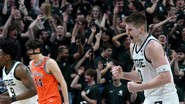 Feb 7, 2026; East Lansing, Michigan, USA;  Michigan State Spartans forward Jaxon Kohler (0) celebrates a big basket against the Illinois Fighting Illini during the first half at Jack Breslin Student Events Center. Mandatory Credit: Dale Young-Imagn Images