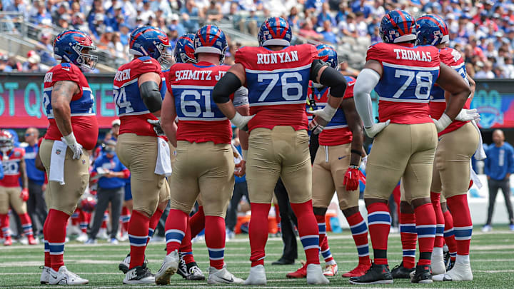 Sep 8, 2024; East Rutherford, New Jersey, USA; New York Giants offensive linemen huddle during the first quarter against the Minnesota Vikings at MetLife Stadium.  