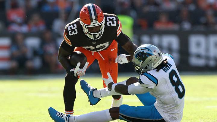 Cleveland Browns running back Raheim Sanders (23)avoids a tackle by Carolina Panthers cornerback Jaycee Horn
