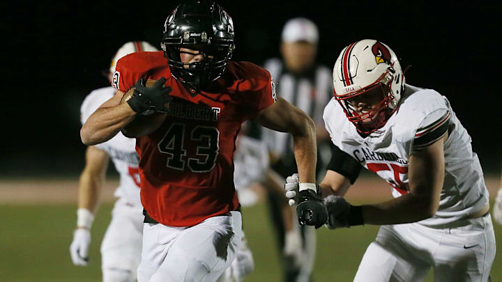 Newton's Nick Milburn (right) committed to Northern Illinois to continue his football career.