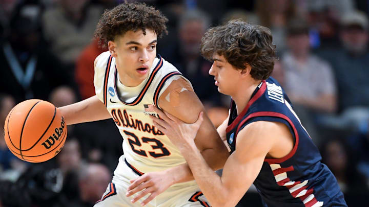 Illinois Fighting Illini guard Keaton Wagler (23) is defended by Penn Quakers guard AJ Levine (0) Thursday, March 19, 2026, during the NCAA Men’s Basketball Tournament first round game at Bon Secours Wellness Arena in Greenville, South Carolina. Illinois Fighting Illini guard Keaton Wagler (23) is defended by Penn Quakers guard AJ Levine (0) Thursday, March 19, 2026, during the NCAA Men’s Basketball Tournament first round game at Bon Secours Wellness Arena in Greenville, South Carolina.