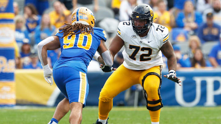 Oct 12, 2024; Pittsburgh, Pennsylvania, USA;  California Golden Bears offensive lineman T.J. Session (72) blocks at the line of scrimmage against Pittsburgh Panthers defensive lineman Sincere Edwards (90) during the first quarter at Acrisure Stadium. Mandatory Credit: Charles LeClaire-Imagn Images