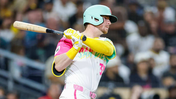 Sep 26, 2025; San Diego, California, USA; San Diego Padres designated hitter Ryan O'Hearn (32) hits a rbi single during the fourth inning Arizona Diamondbacks at Petco Park. Mandatory Credit: David Frerker-Imagn Images