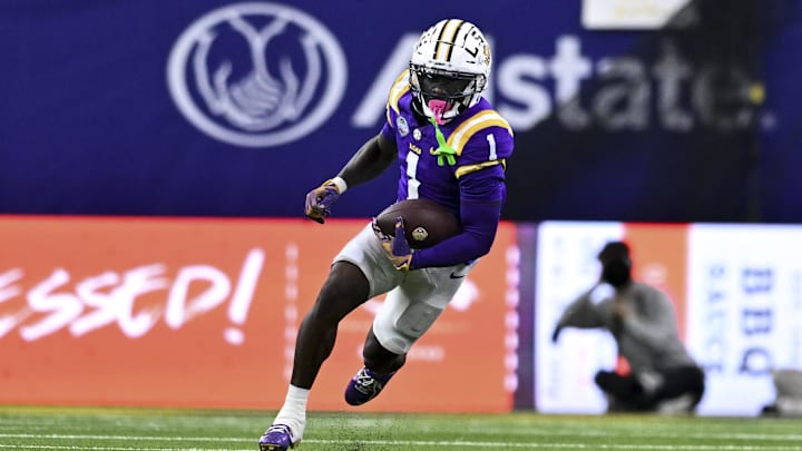 Dec 31, 2024; Houston, TX, USA; LSU Tigers wide receiver Aaron Anderson (1) runs the ball during the second half against the Baylor Bears at NRG Stadium. The Tigers defeat the Bears 44-31. Mandatory Credit: Maria Lysaker-Imagn Images 