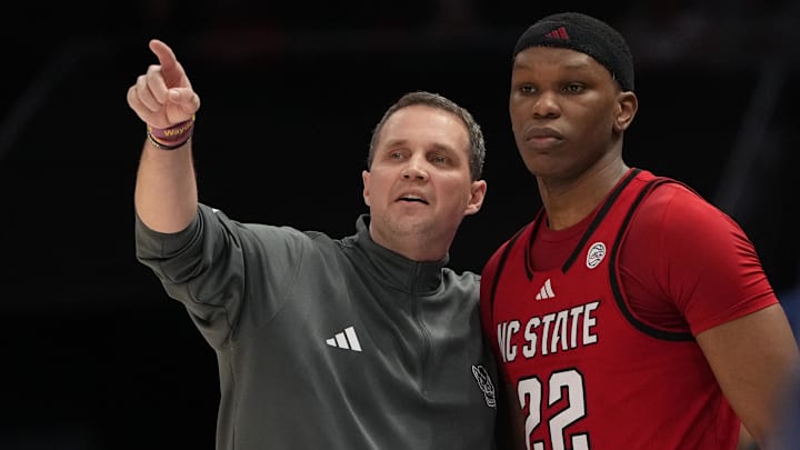 Mar 12, 2026; Charlotte, NC, USA; NC State Wolfpack head coach Will Wade with forward Ven-Allen Lubin (22) in the first half at Spectrum Center. Mandatory Credit: Bob Donnan-Imagn Images