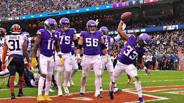 Nov 24, 2024; Chicago, Illinois, USA; Minnesota Vikings running back Aaron Jones (33) celebrates his rushing touchdown against the Chicago Bears during the third quarter at Soldier Field. Mandatory Credit: Daniel Bartel-Imagn Images