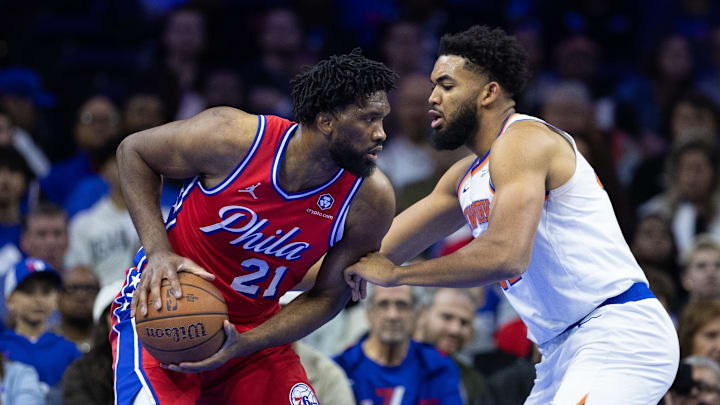 Nov 12, 2024; Philadelphia, Pennsylvania, USA; Philadelphia 76ers center Joel Embiid (21) controls the ball against New York Knicks center Karl-Anthony Towns (32) during the first quarter at Wells Fargo Center. Mandatory Credit: Bill Streicher-Imagn Images