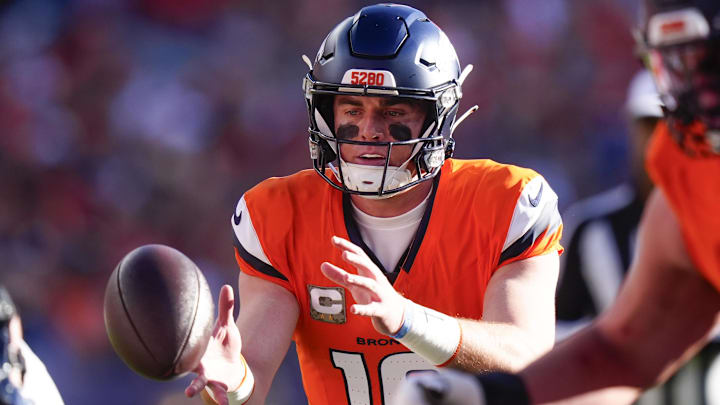 Nov 16, 2025; Denver, Colorado, USA;  Denver Broncos quarterback Bo Nix (10) takes the snap during the first quarter of the game against the Kansas City Chiefs at Empower Field at Mile High. 