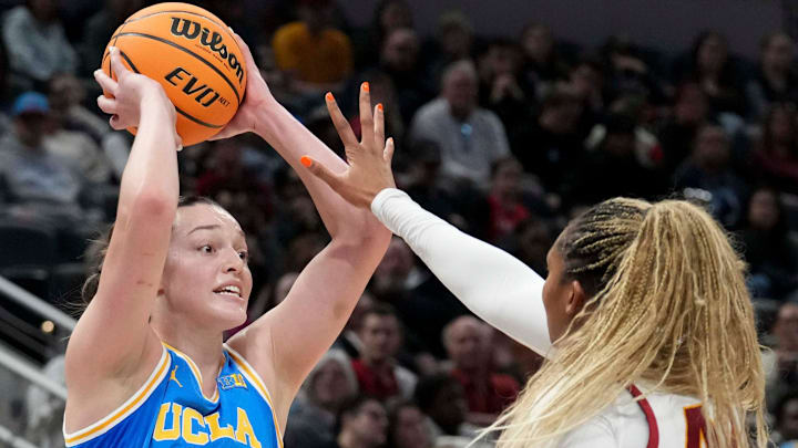 USC Trojans forward Kiki Iriafen (44) guards UCLA Bruins forward Angela Dugalić (32) during the first half of the 2025 TIAA Big Ten Women's Basketball Tournament final game on Sunday, March 9, 2025, at Gainbridge Fieldhouse in Indianapolis. UCLA defeated USC 72-67.