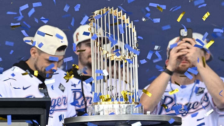 Nov 3, 2023; Arlington, TX, USA; A view of the Texas Rangers team and trophy as the confetti flies during the celebration outside of the ballpark after the World Series championship parade at Globe Life Field. Mandatory Credit: Jerome Miron-Imagn Images