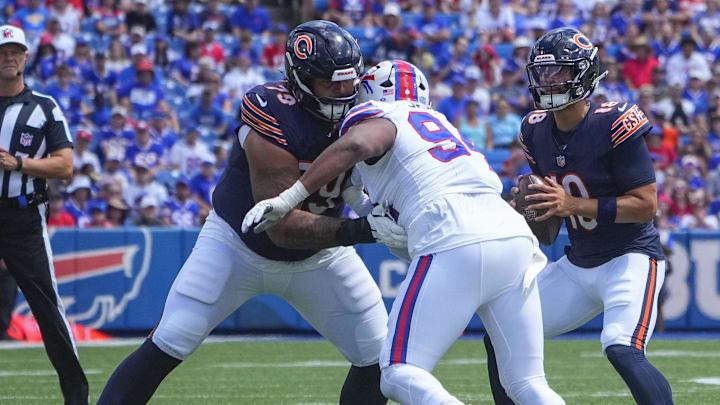 Aug 10, 2024; Orchard Park, New York, USA; Chicago Bears guard Matt Pryor (79) blocks Buffalo Bills defensive end Dawuane Smoot (94) during the first half at Highmark Stadium. 