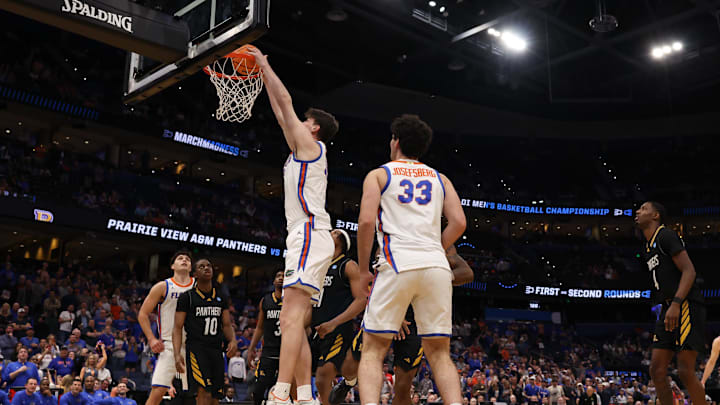 Mar 20, 2026; Tampa, FL, USA; Florida Gators center Olivier Rioux (32) dunks the ball in the second half against the Prairie View A&M Panthers during a first round game of the men's 2026 NCAA Tournament at Benchmark International Arena. Mandatory Credit: Matt Pendleton-Imagn Images