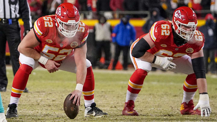 Jan 13, 2024; Kansas City, Missouri, USA; Kansas City Chiefs center Creed Humphrey (52) and guard Joe Thuney (62) at the line of scrimmage against the Miami Dolphins in a 2024 AFC wild card game at GEHA Field at Arrowhead Stadium. Mandatory Credit: Denny Medley-Imagn Images