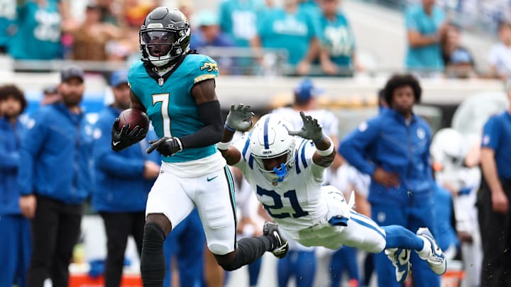 Jacksonville Jaguars wide receiver Brian Thomas Jr. outruns a tackle from Indianapolis Colts cornerback Dallis Flowers.