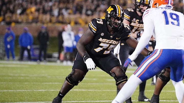 Nov 18, 2023; Columbia, Missouri, USA; Missouri Tigers offensive lineman Armand Membou (79) at the line of scrimmage against the Florida Gators during the game at Faurot Field at Memorial Stadium. Mandatory Credit: Denny Medley-Imagn Images Nov 18, 2023; Columbia, Missouri, USA; Missouri Tigers offensive lineman Armand Membou (79) at the line of scrimmage against the Florida Gators during the game at Faurot Field at Memorial Stadium. Mandatory Credit: Denny Medley-Imagn Images