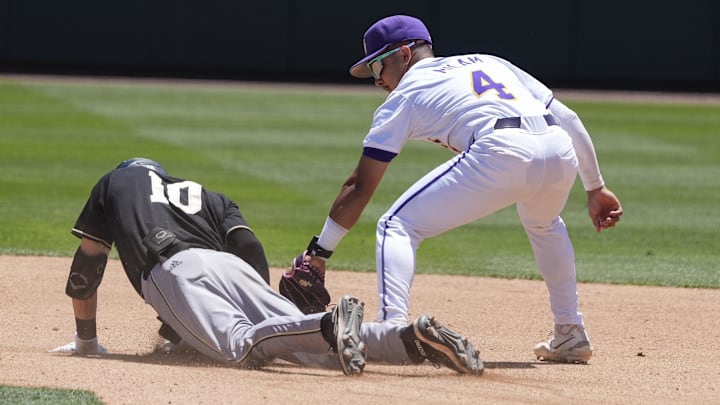 May 31, 2024; Chapel Hill, NC, USA; Wofford infielder Brice Martinez (10) dives for second covered by LSU infielder Steven Milam (4) during the NCAA Regional in Chapel Hill. Mandatory Credit: Jim Dedmon-Imagn Images
