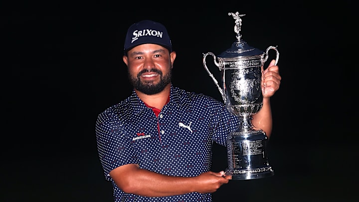 J.J. Spaun poses with the winner's trophy following his victory at the 2025 U.S. Open at Oakmont Country Club