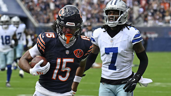 Sep 21, 2025; Chicago, Illinois, USA; Chicago Bears wide receiver Rome Odunze (15) catches a touchdown pass against Dallas Cowboys wide receiver Traeshon Holden (7) during the first half at Soldier Field. 