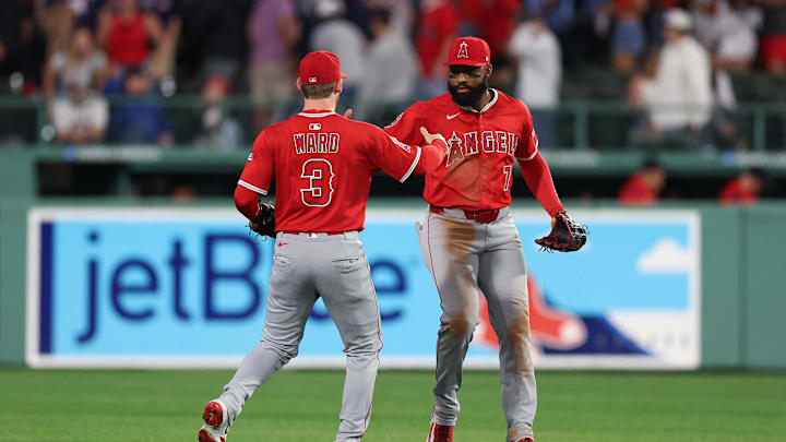 Jun 3, 2025; Boston, Massachusetts, USA; Los Angeles Angels center fielder Jo Adell (7) and Los Angeles Angels left fielder Taylor Ward (3) celebrate after defeating the Boston Red Sox at Fenway Park. Mandatory Credit: Paul Rutherford-Imagn Images