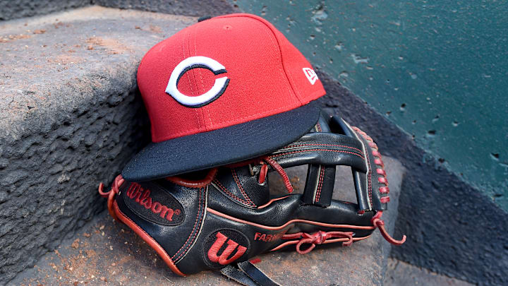 Cincinnati Reds hat and glove.