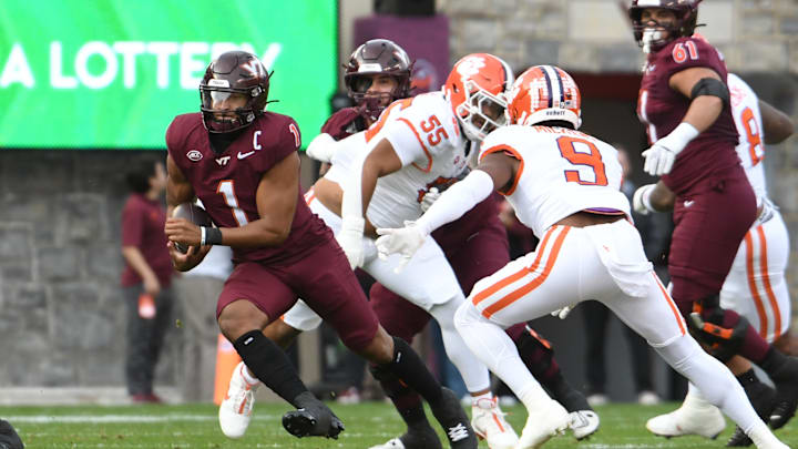 Nov 9, 2024; Blacksburg, Virginia, USA;  Virginia Tech Hokies quarterback Kyron Drones (1) runs the ball against the Clemson Tigers during the first quarter at Lane Stadium.