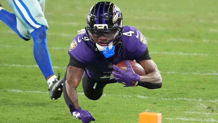 Sep 27, 2026; Rio De Janeiro, BRA;  Baltimore Ravens wide receiver Zay Flowers (4) dives with the ball during the game against the Dallas Cowboys at Maracana Stadium.  Mandatory Credit: Kirby Lee-Imagn Images