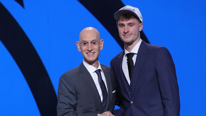 Jun 25, 2025; Brooklyn, NY, USA;  Cooper Flagg poses with NBA commissioner Adam Silver after being selected as first overall by the Dallas Mavericks in the first round of the 2025 NBA Draft at Barclays Center. Mandatory Credit: Brad Penner-Imagn Images