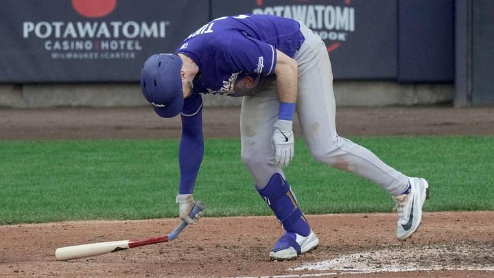 Los Angeles Dodgers right fielder Kyle Tucker (23) breaks his bat after flying out with two runners win base during the ninth inning of their game Sunday, May 24, 2026 at American Family Field in Milwaukee, Wisconsin.