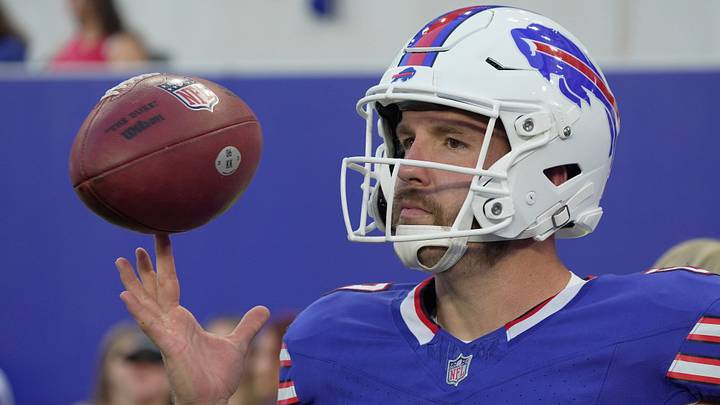 Buffalo Bills long snapper Reid Ferguson twirls the ball on his finger during the game against the Pittsburgh Steelers.
