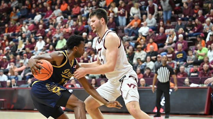 Jan 17, 2026; Blacksburg, Va.; Notre Dame guard Sir Mohammed (13) drives against Virginia Tech center Christian Gurdak (32).