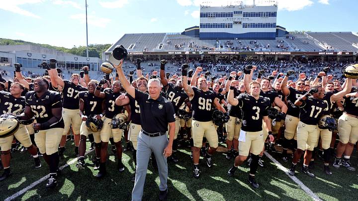 Army Black Knights head coach Jeff Monken celebrates with his team after Army's 59-3 win against Bryant Army Black Knights head coach Jeff Monken celebrates with his team after Army's 59-3 win against Bryant