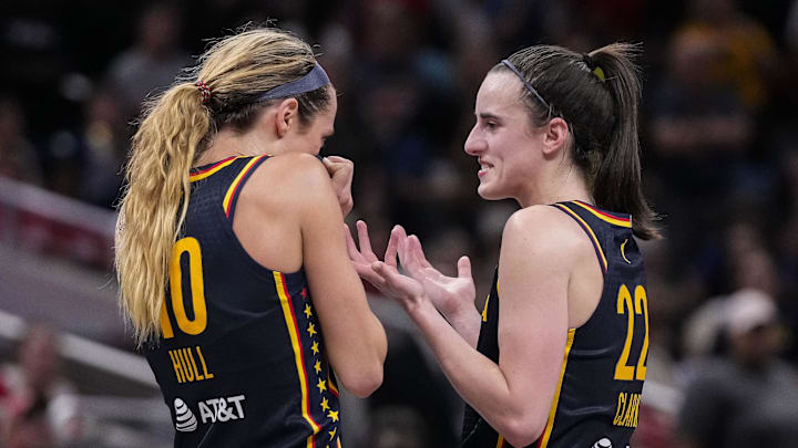 Sep 15, 2024; Indianapolis, Indiana, USA; Indiana Fever guard Caitlin Clark (22) and guard Lexie Hull (10) talk during a timeout at Gainbridge Fieldhouse. Sep 15, 2024; Indianapolis, Indiana, USA; Indiana Fever guard Caitlin Clark (22) and guard Lexie Hull (10) talk during a timeout at Gainbridge Fieldhouse.
