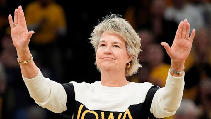 Former Iowa women’s basketball head coach Lisa Bluder, waves to the crowd during a recognition ceremony at halftime of the Iowa Hawkeyes game against the Maryland Terrapins Sunday, Jan. 5, 2025 at Carver-Hawkeye Arena in Iowa City, Iowa. Former Iowa women’s basketball head coach Lisa Bluder, waves to the crowd during a recognition ceremony at halftime of the Iowa Hawkeyes game against the Maryland Terrapins Sunday, Jan. 5, 2025 at Carver-Hawkeye Arena in Iowa City, Iowa.