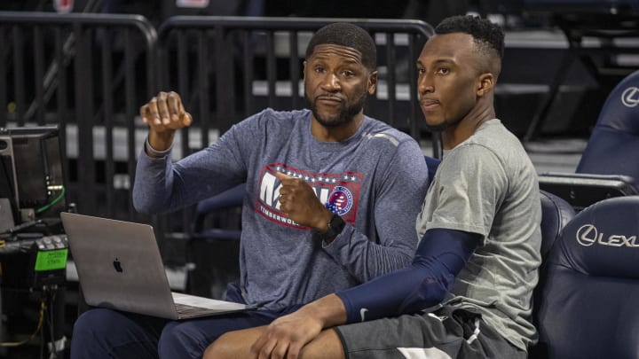 Nov 15, 2019; Minneapolis, MN, USA; Minnesota Timberwolves guard Josh Okogie (right) talks with Minnesota Timberwolves development coach Kevin Burleson (left) before a game against the Washington Wizards at Target Center. Mandatory Credit: Jesse Johnson-USA TODAY Sports