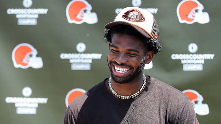 Cleveland Browns quarterback Shedeur Sanders (12) jokes about his signing bonus during a press conference before day two of NFL rookie minicamp at the Cleveland Browns training facility on Saturday, May 10, 2025, in Berea, Ohio.