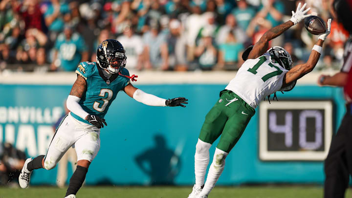 Dec 15, 2024; Jacksonville, Florida, USA; New York Jets wide receiver Davante Adams (17) catches a pass defended by Jacksonville Jaguars cornerback Tyson Campbell (3) in the fourth quarter  at EverBank Stadium. Mandatory Credit: Nathan Ray Seebeck-Imagn Images