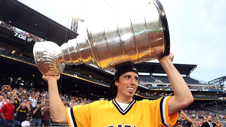 Jun 13, 2017; Pittsburgh, PA, USA;  Pittsburgh Penguins goalie Marc-Andre Fleury (29) carries the Stanley Cup onto the field before the Pittsburgh Pirates play the Colorado Rockies at PNC Park. Mandatory Credit: Charles LeClaire-Imagn Images