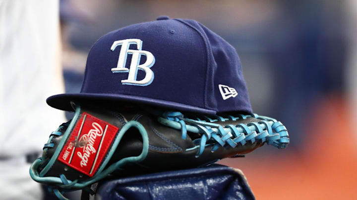 Sep 6, 2019; St. Petersburg, FL, USA; A detail view of a Tampa Bay Rays hat and glove at Tropicana Field.